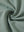 Close-up of fabric on textured insulated winter jacket, showing texture and finish in beryl green