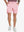 Front lower-body view of model wearing PINK Water Resistant Versatile 8 Pockets Shorts.