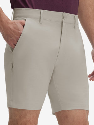 Front lower body shot of model wearing fossil flat front hybrid golf shorts