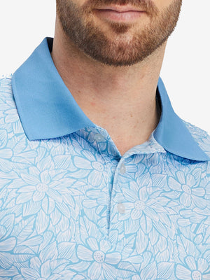 Front view from nose to chest of model wearing blue antichoke premium ribbed collar print polo shirts