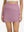 Front lower body shot of model wearing lavender pink high waist built-in short a-line golf skirt with 5 pockets