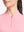 Front shot from nose to chest of model wearing pink coral white women's q-zip pin striped texture golf shirts