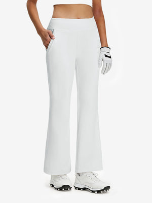 Front lower body shot of model wearing white women's high waist stretch golf pants with pockets