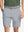 Front waist to knee view of grey water resistant golf 9 inch shorts, clean athletic fit.
