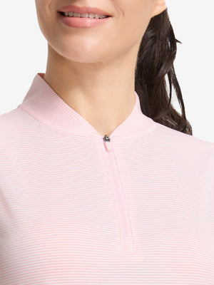 Front shot from nose to chest of model wearing light pink white women's q-zip pin striped texture golf shirts