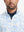 Close-up from nose to chest, showing zipper collar detail and fabric pattern of the sky blue camo pullover.