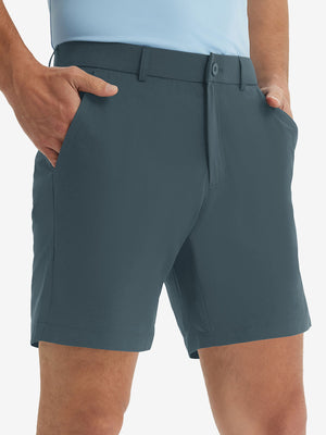 Front lower body shot of model wearing the grey blue stretch soft flat front dress golf shorts, showcasing the fit