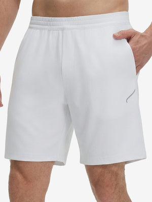 Front lower body shot of model wearing white 4 way stretch breathable workout athletic shorts