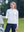 Model holding a golf club and touching a golf cart, wearing women's lightweight hoodies pullover in white on course
