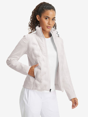 Model wearing women's lightweight fleece-lined puffer jacket, oyster gray, front upper-body look.