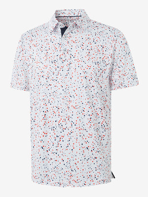 Front half-body shot of model wearing the white polka dots 4 way stretch print collared polo shirt for a casual sporty look