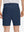Back lower body shot of model wearing dark blue flat front flex cotton blend golf shorts