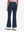 Back lower body shot of model wearing navy women's high waist stretch golf pants with pockets