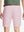Back waist to knee view of pink water resistant golf 9 inch shorts, flexible performance fit.