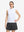 Front upper body shot of model wearing white women's moisture-wicking mock neck sleeveless golf tops