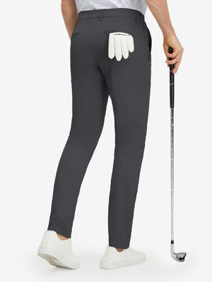 Back lower body shot of model wearing dark grey stretch cotton blend slim fit golf trousers 5 pockets