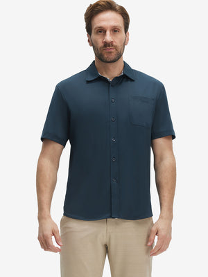 Front upper body shot of model wearing navy cool print plain button up shirts
