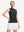Front upper body shot of model wearing black women's moisture-wicking mock neck sleeveless golf tops