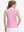 Back upper body shot of model wearing white pink geometric women's sleeveless v-neck print golf shirts