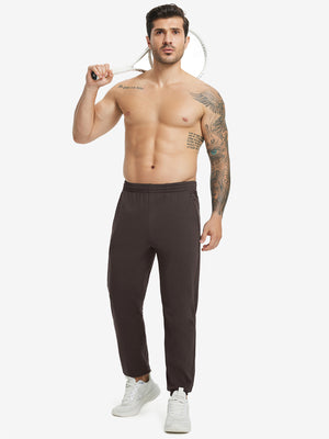 Full body front view of model wearing Water Resistant Comfy Fleece Golf Joggers in coffee brown
