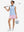 Front full body shot of model with golf gear wearing light pink women's gym golf shorts with liner pocket