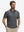 Front half-body shot of model wearing the yellow duck 4 way stretch print collared polo shirt for a casual sporty look
