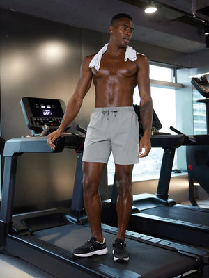 Full-body gym view of model in LIGHT GREY 2 in 1 Running Sports Shorts with Liner
