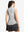 Back upper body shot of model wearing light grey white women's q-zip pin striped texture golf shirts