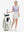 Front full body shot of model exercising in lavender rose women's sleeveless v-neck print golf shirts