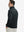 Back upper body view of the dark grey lightweight golf pullover, model turns head slightly with ease.