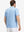 Back upper body shot of model wearing blue white abstract maze premium ribbed collar print polo shirts