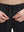 Detail view of elastic waistband on black 4 way stretch breathable workout athletic shorts