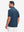Back upper body view in dark blue heather of performance heather contrast collar polo shirts.