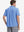 Model half-body back view wearing blue cotton blend plain shirt.
