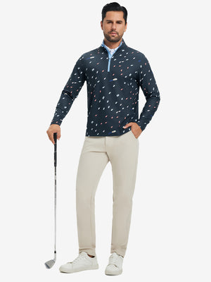 Full-body shot of model holding golf club, dressed in full print quarter zip pullover in ocean yacht.