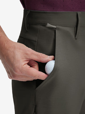 Detail view of front pocket on tea brown flat front hybrid golf shorts