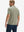 Back half body shot of model wearing birch grey grid performance reflective checked collar golf shirt