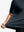 Side fabric stretch display in navy of men's short sleeve slim fit roma knit t-shirt.