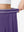 Detail view of elastic waistband on dark purple women's moisture-wicking athletic tennis skirts