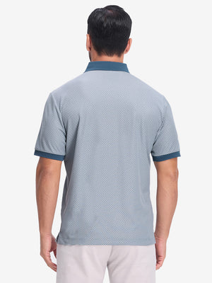 Back upper body shot of model wearing misty blue moisture wicking jacquard golf shirts