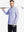 Full-body shot of model holding a golf club in light purple melange moisture wicking quarter zip pullover
