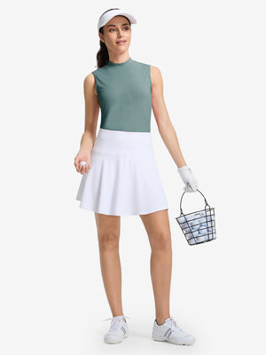 Front full body shot of model wearing dusty blue women's moisture-wicking mock neck sleeveless golf tops