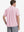 Model half-body back view wearing pink cotton blend plain shirt.