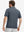 Back upper body shot of model wearing dark blue classic lightweight jacquard golf shirts