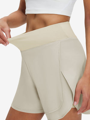 Detail view of elastic waistband on oyster gray women's gym golf shorts with liner pocket