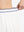 Detail view of elastic waistband on white women's moisture-wicking athletic tennis skirts
