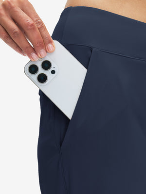 Detail shot of the side pocket on the navy women's lightweight high waisted golf pants, showing functionality