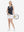 Front full body shot of model playing golf in black gray blocks women's sleeveless v-neck print golf shirts