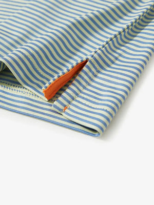 Hem slit detail of YELLOW STRIPE polo, tailored finish meets bold summer stripe palette