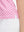Detail view of hem on white pink geometric women's sleeveless v-neck print golf shirts